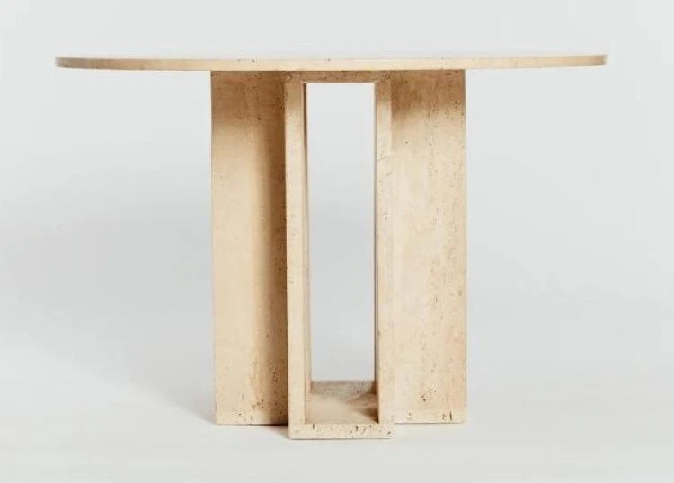 Round travertine dining table with cubist base Round travertine dining table with cubist base